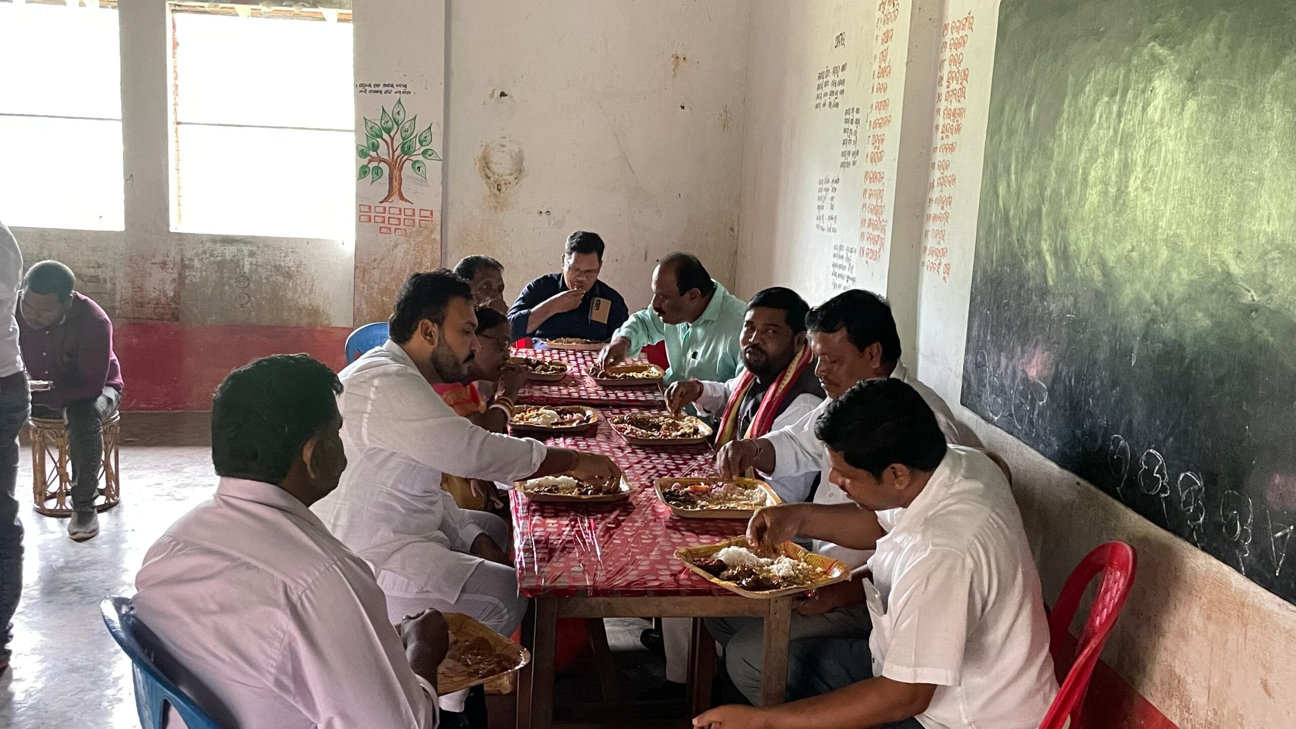 MLA Rupesh Panigrahi Eating With People while interacting with them